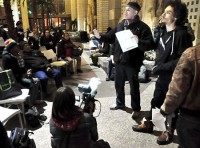 The guy holding the white form showed up well after the discussion began and, complaining that an OWS Facilitator treated him with disrespect, voted to block the plan.