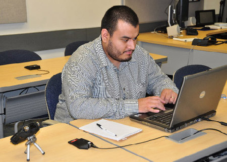 Jonathan Mena, a former WORD Senior Editor-Producer, posting information on Facebook during the September 27, 2010, conference call. ICIT's Distance Learning, for whom Mena now works, made possible the WORD's participation. Mena is officially graduates this semester.